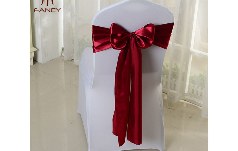 Chair cover with red ribbon - A